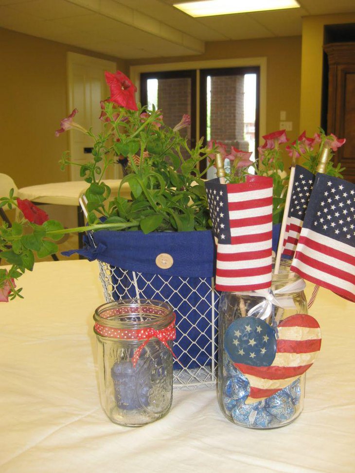 4th of July retirement party table decor with mason jars and flowers