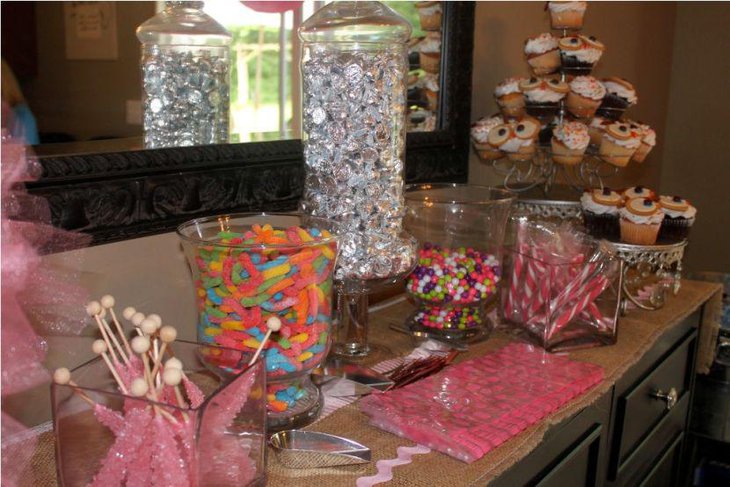 A baby shower candy table with a delectable spread of candies
