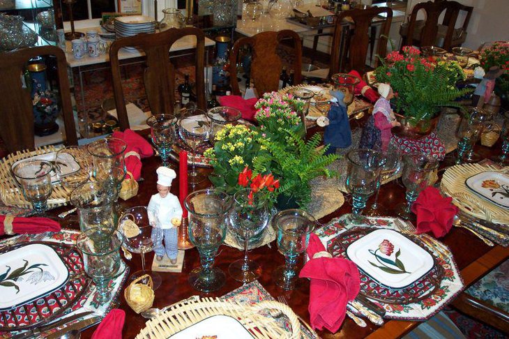 A table with an eclectic mix of French Santons and Italian plates