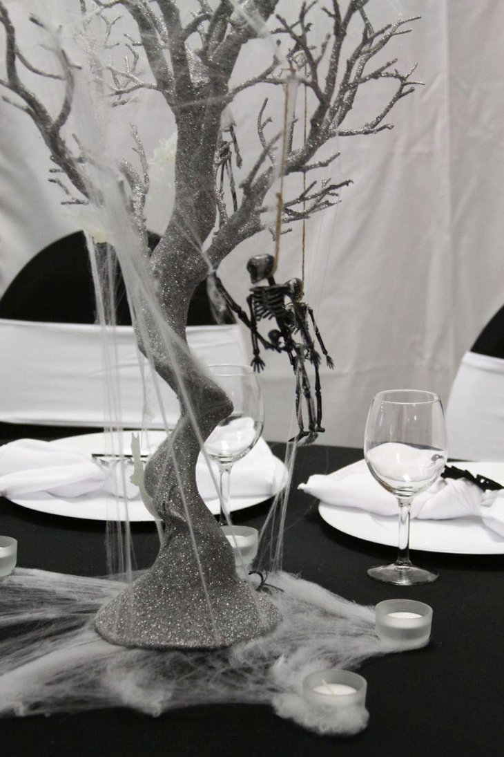 A tree with hanging skeleton centerpiece for Halloween