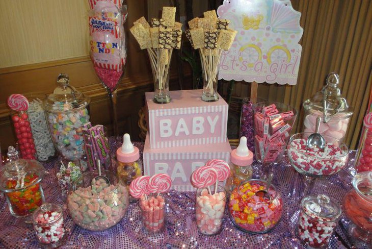 A very delicious spread of baby shower candies in different colours