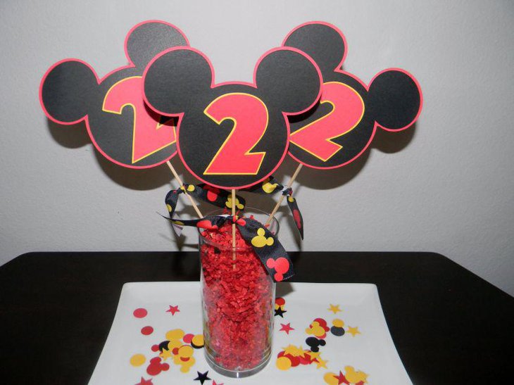 Adorable glass jar with Mickey Mouse cutout birthday table centerpiece