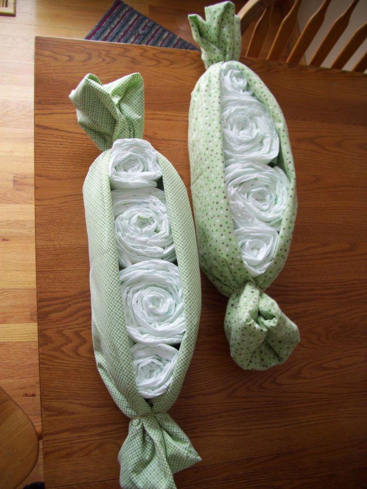Adorable two peas in a pod themed diaper decor for a twin baby shower