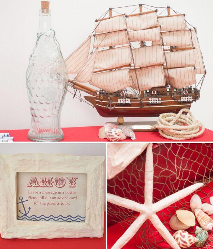 Ahoy nautical baby shower table decor with sailboat and sea shells