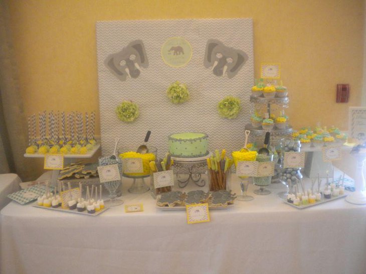 Amazing grey and yellow dessert table idea for baby shower