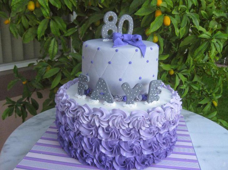 Amazing white and purple cake display on an 80th birthday table for a beloved mother