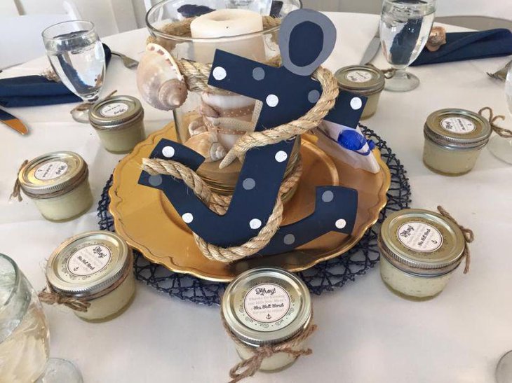 Anchor and candle centerpiece on nautical themed baby shower table