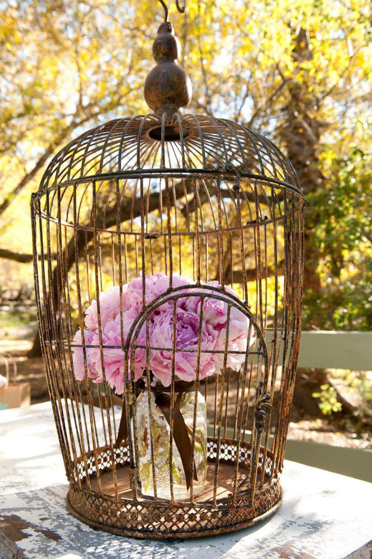 Antique DIY birdcage centerpiece on wedding table