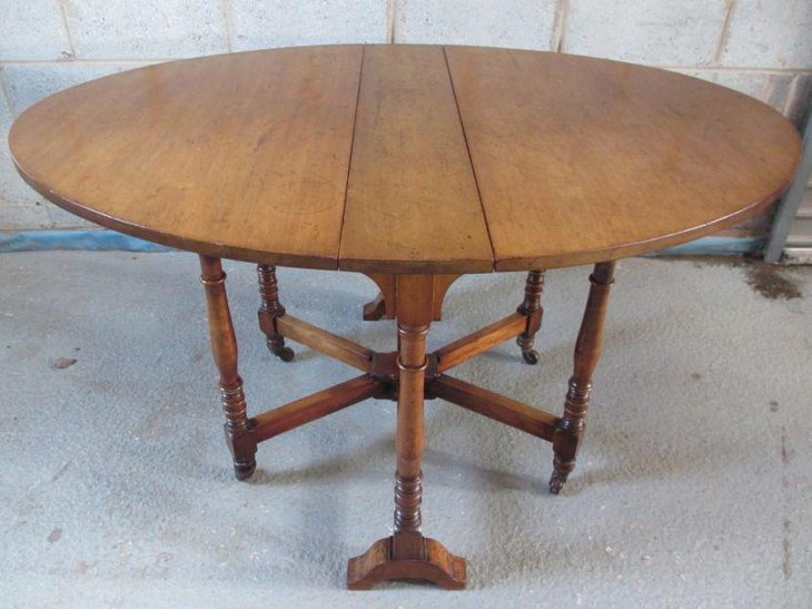 Antique oval drop leaf dining table design