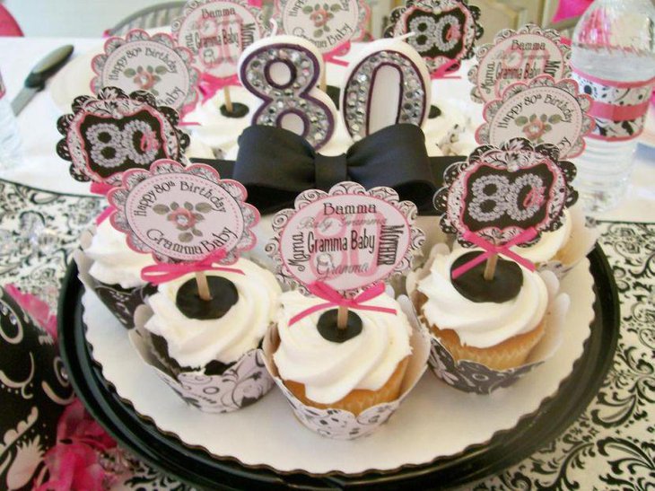 Appealing cupcake centerpiece decor on 80th birthday table