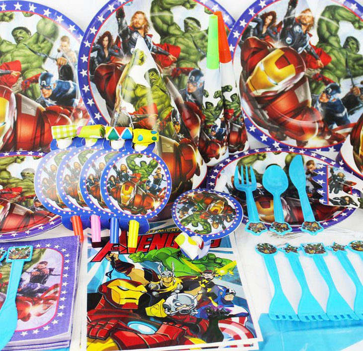 Avengers party plates and spoons laid out as favours on the birthday table