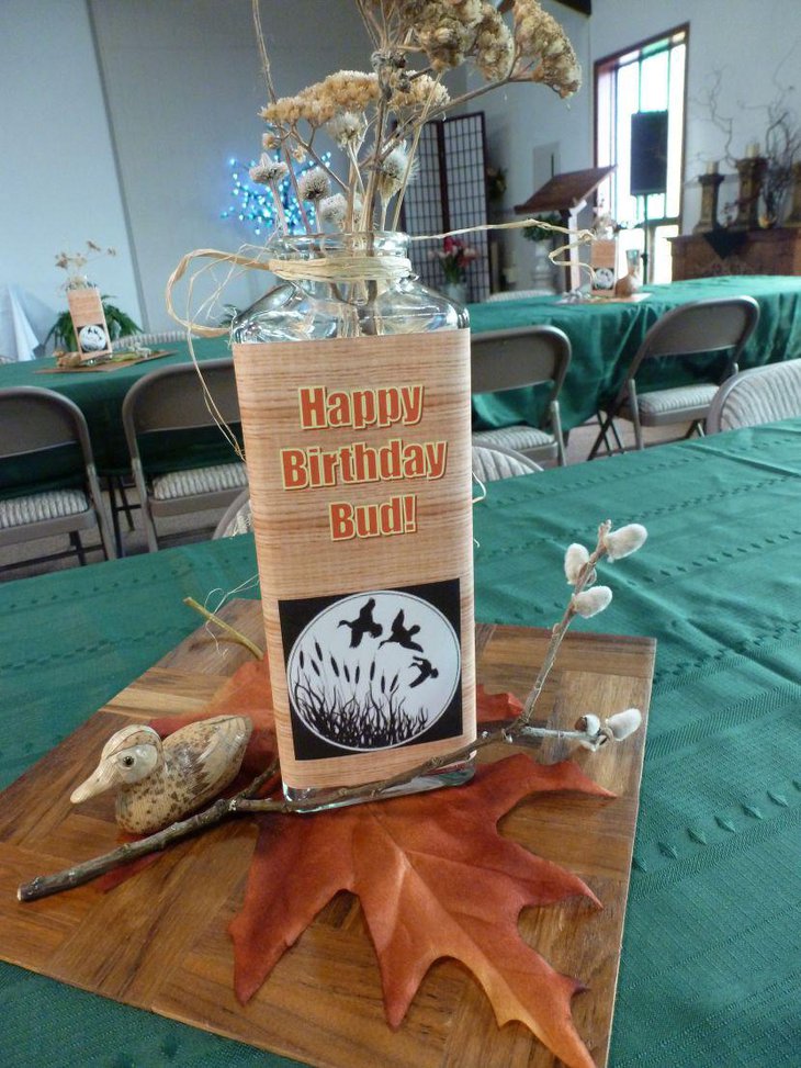 Awesome bird jar and willow centerpiece on 80th birthday table of a loved dad