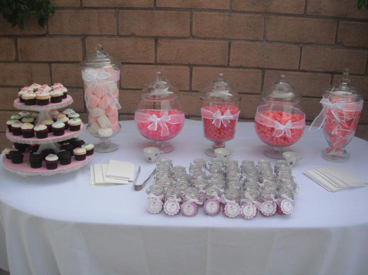 Baby pink accented baby shower candy table decor
