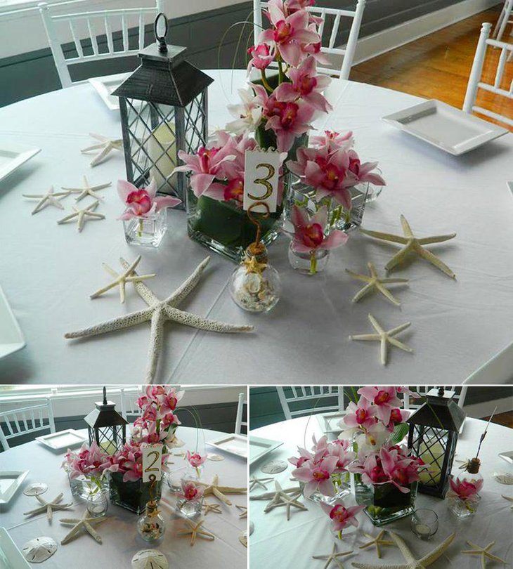 Beach themed wedding table decor with starfish and flowers