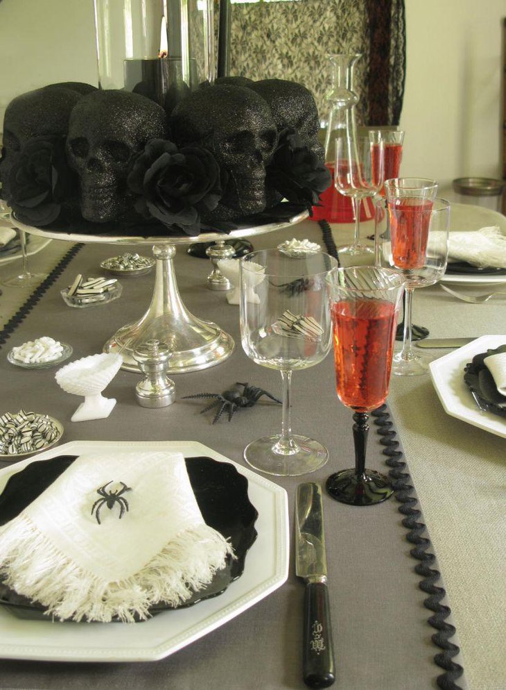 Beautiful black skulls and roses as Halloween centerpiece