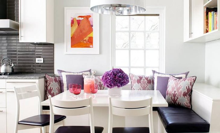 Beautiful Breakfast Nook With Fresh Flowers And Ample Lighting