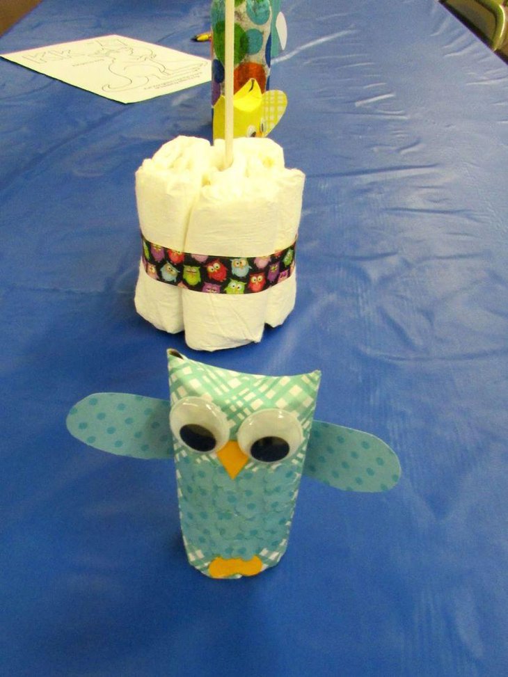 Beautiful owl centerpiece on a baby shower table