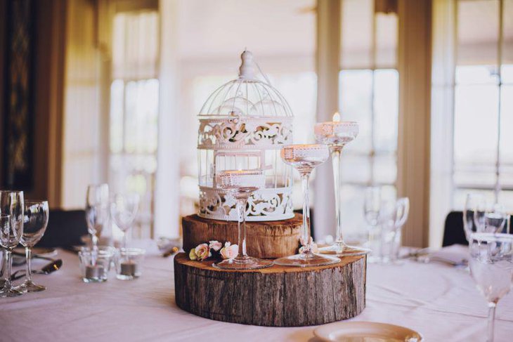 Beautiful Rustic Birdcage With Wooden Slices As Wedding Table Centerpiece