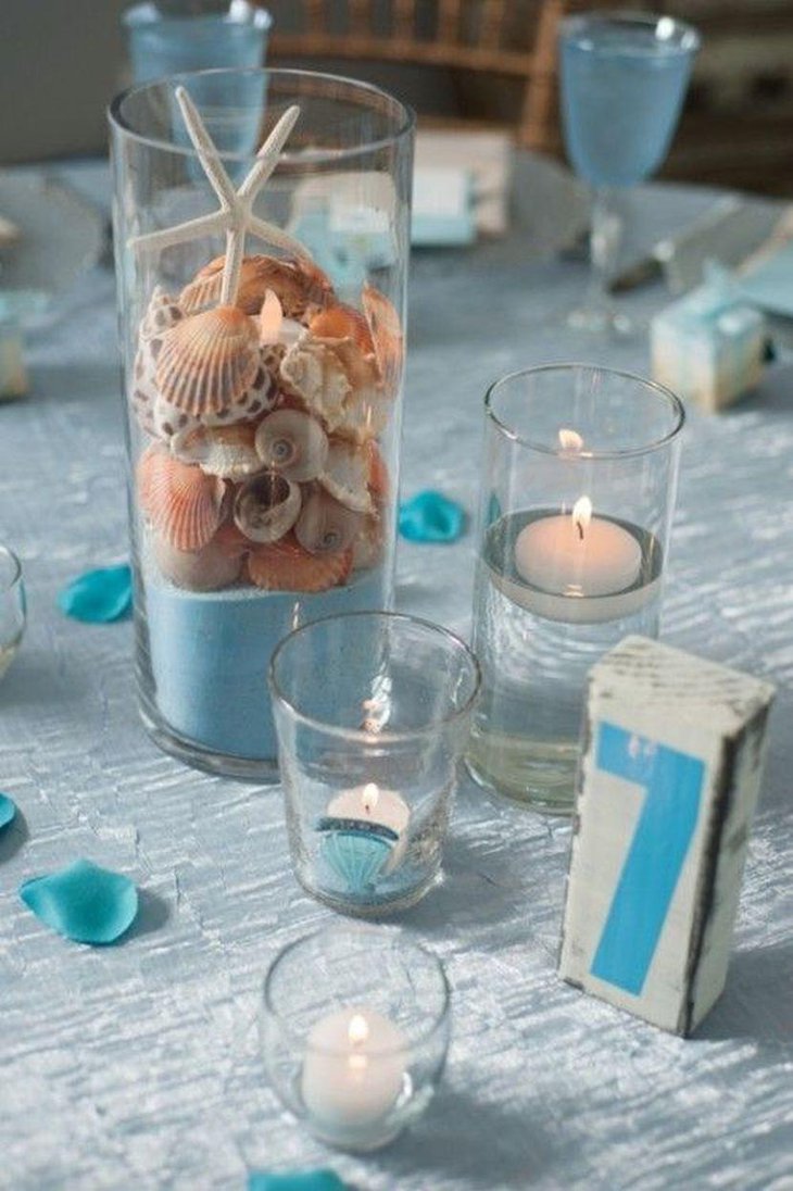Beautiful shells in a glass jar wedding table centerpiece