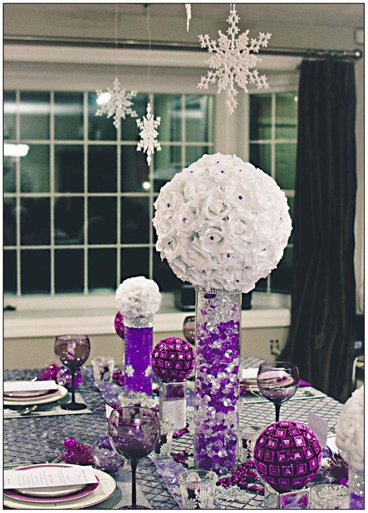Beautiful winter wedding table decor with purple decorations