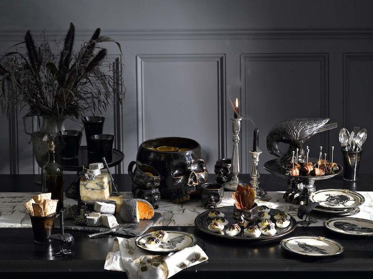 Bewitching Halloween dessert table decor with black eerie decorative accessories