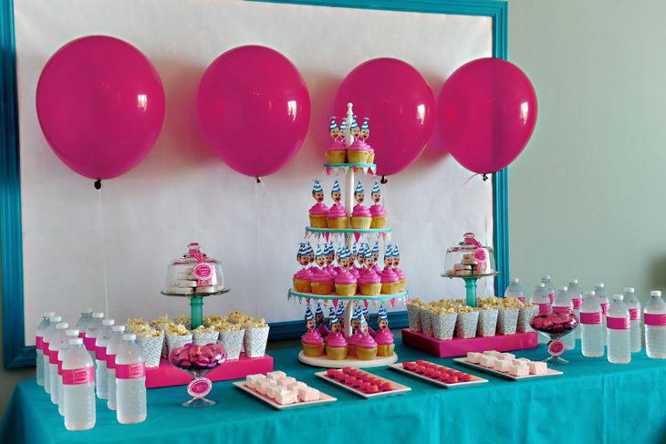 Blue and pink accented birthday party dessert table decor