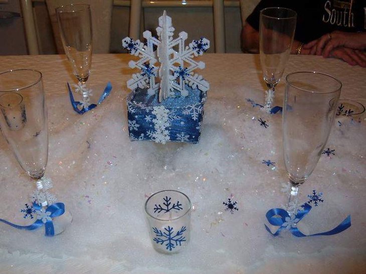 Blue and white snowflake centerpiece for winter party table
