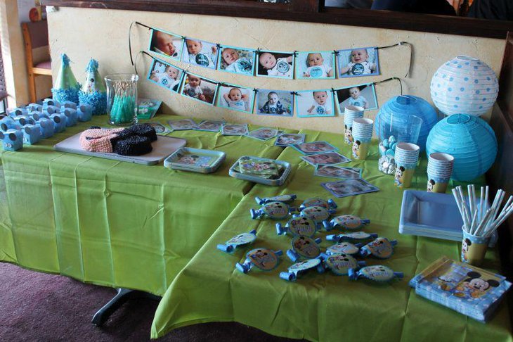 Blue Mickey Mouse decorations on boys first birthday table