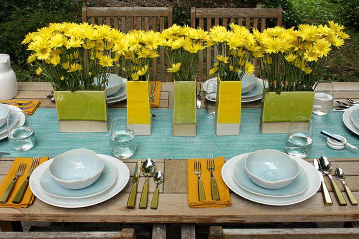 Breezy garden party table decor with blue green and yellow accents