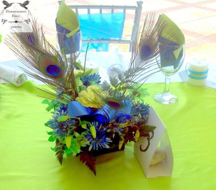 Bright peacock centerpiece with flowers