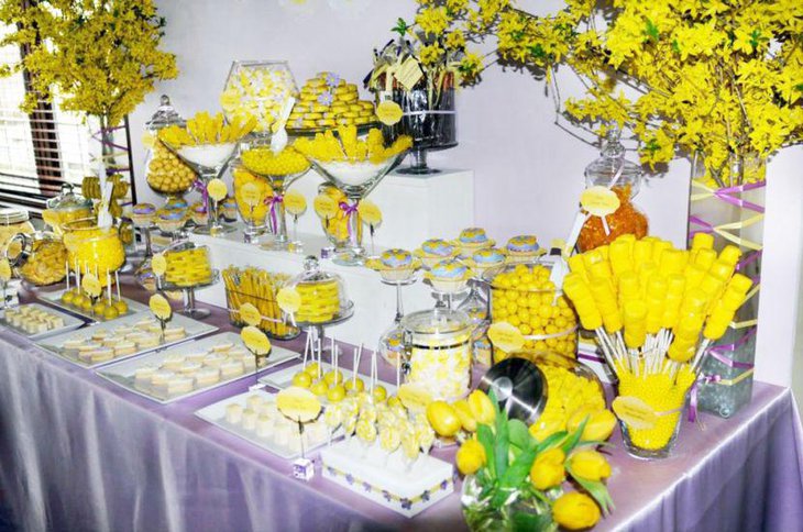 Bright yellow candy spread on baby shower candy table