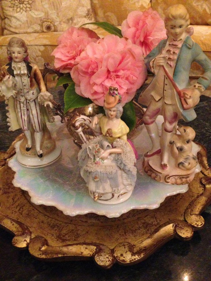 Ceramic figurines on tray Valentines centerpiece