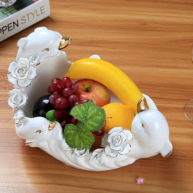 Ceramic fruit bowl centerpiece decor on modern coffee table