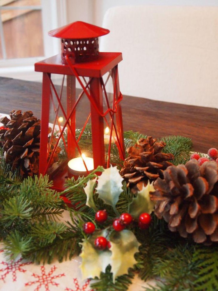 Christmas Table Centerpiece Idea With Red Lantern With Candle and Pinecones