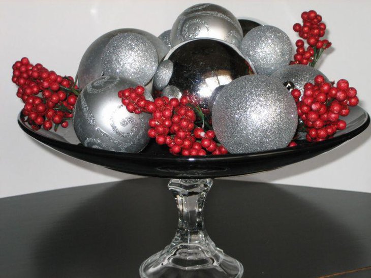 Christmas Table Centerpiece With Black Bowl Filled With Cranberries and Silver Balls