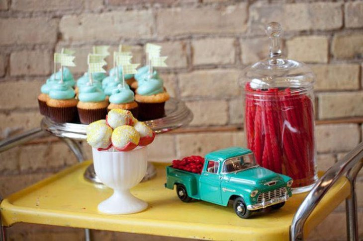 Classy wedding dessert table decor with vintage car with candies