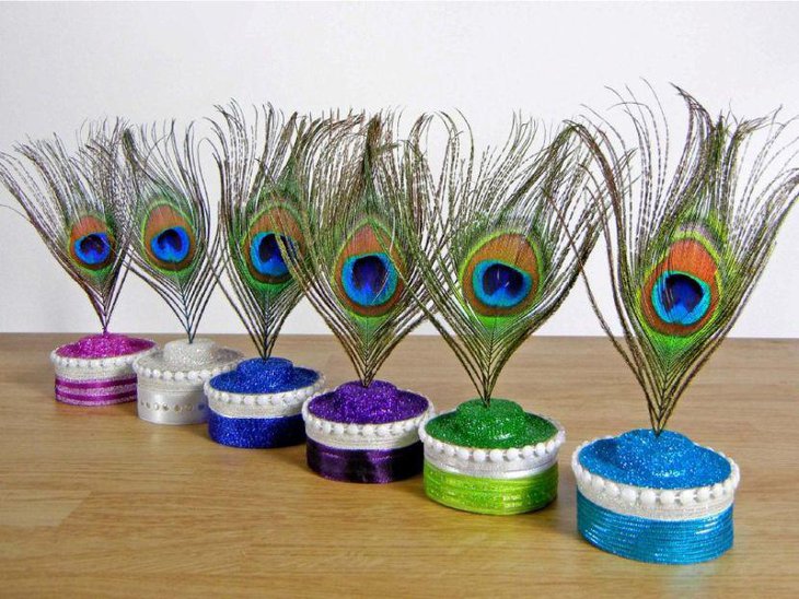 Colourful bridal shower peacock feather centerpieces