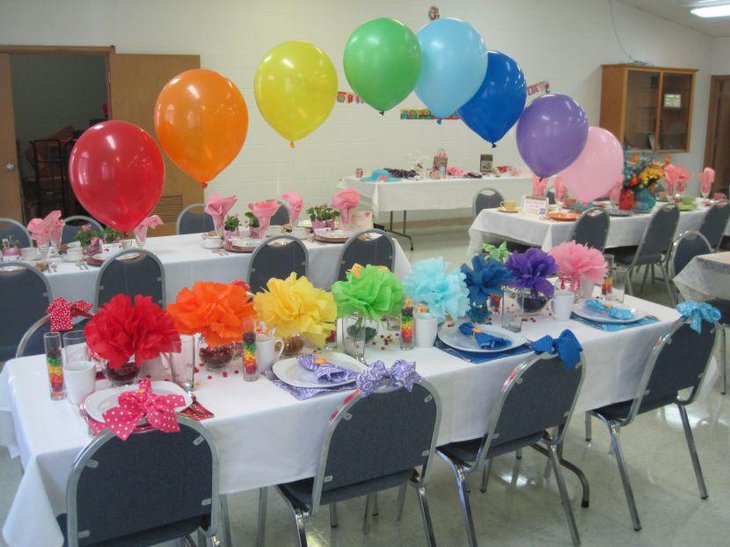 Colourful retirement table decor with ruffled floral centerpieces