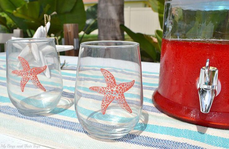 Cool beachy inspired garden party table decor with glasses embossed with starfish
