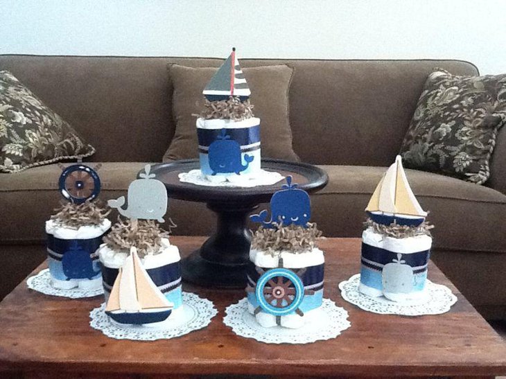 Crafty nautical diaper cake centerpiece decor on table