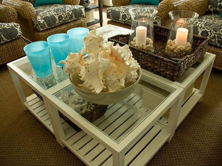 Creative coastal inspired coffee table decor with rattan basket and conches