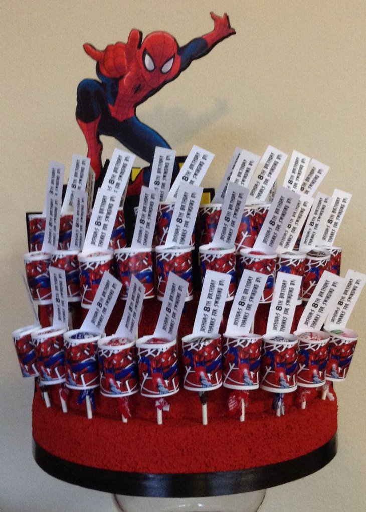 Creative Spiderman birthday party table centerpiece with candies and Spiderman cutout
