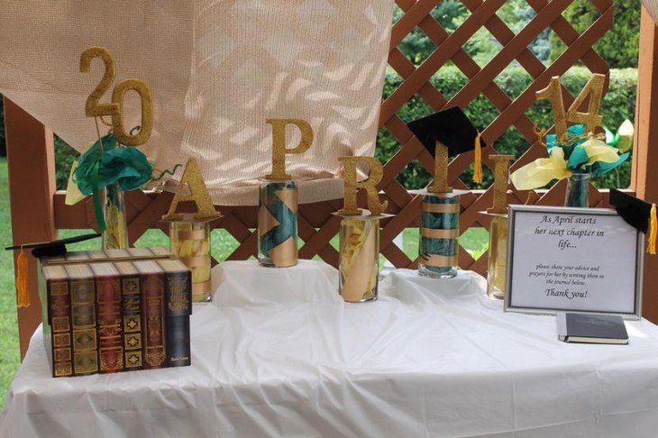 Customised golden accented graduation party centerpieces
