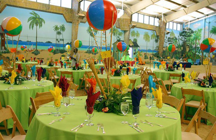 Cute beach party table decor with colourful ball centerpieces