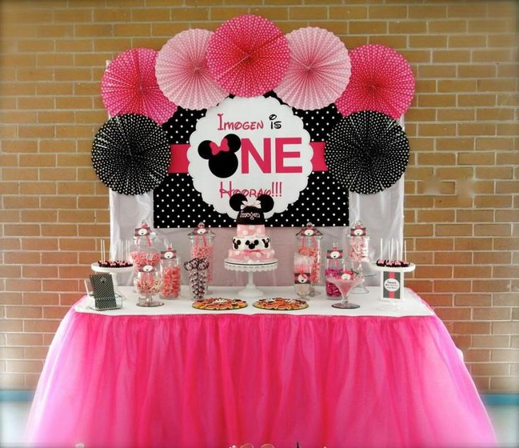 Cute Birthday Dessert Table with Minnie Mouse Styled Candy Jars and Cake