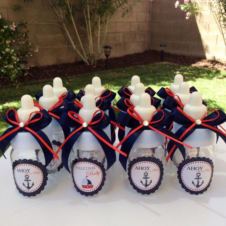Cute blue and white nautical baby shower table decor with bottles