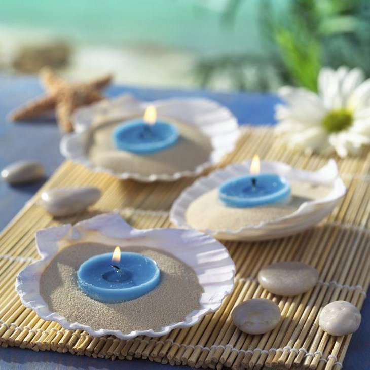 Cute blue candles on shell wedding centerpieces