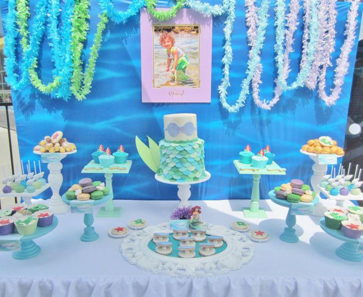 Cute blue candy table for mermaid themed birthday party
