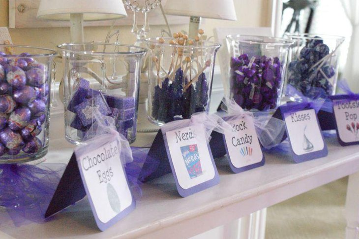 Cute display of purple candy on wedding candy table