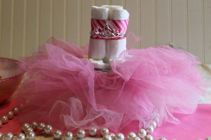 Cute DIY diaper tutu cake centerpiece decoration on girl baby shower table